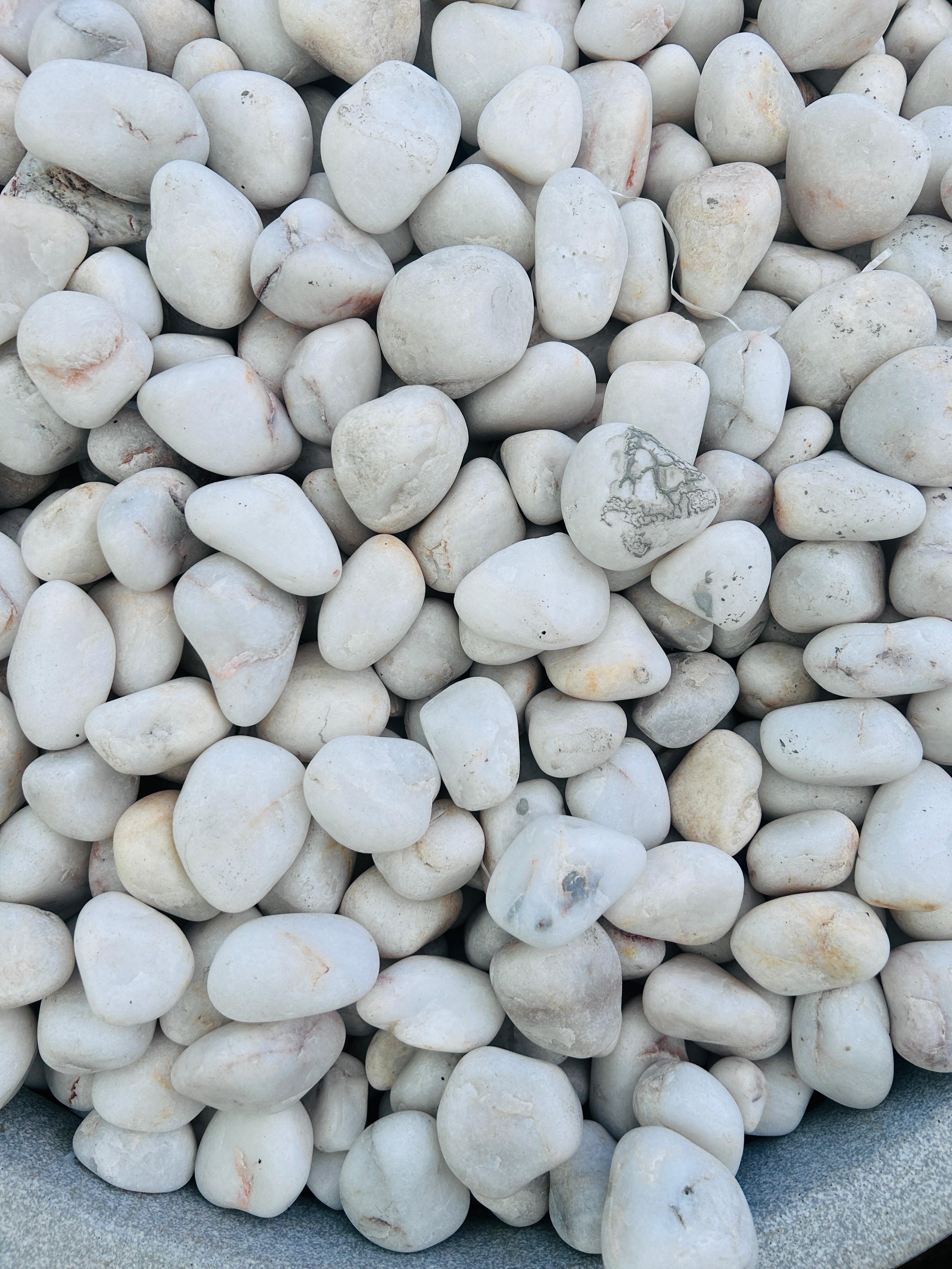 WHITE SEMI POLISHED PEBBLES